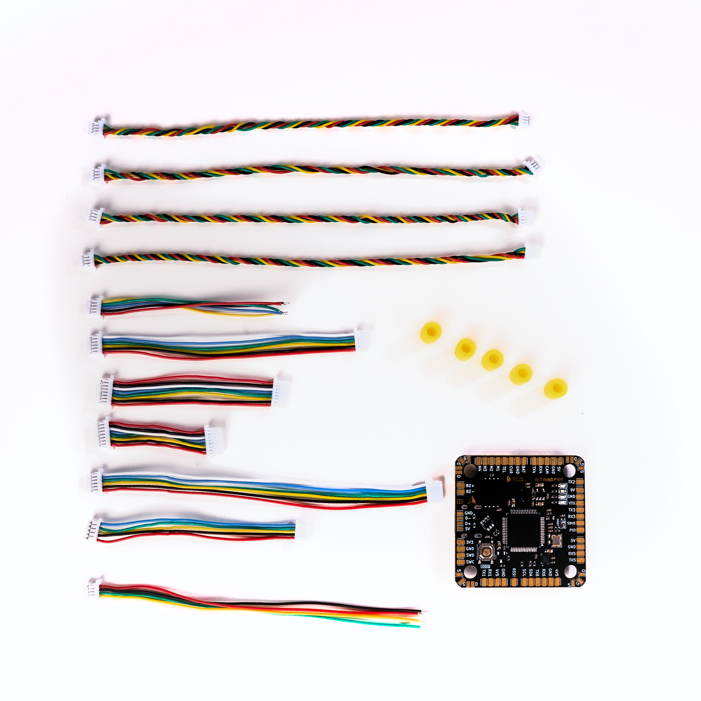 BotWing F4 flight controller board designed for drones, featuring compact layout & connectors.